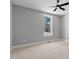 Well-lit bedroom featuring a ceiling fan, neutral tones, and bright windows at 2662 Sledge Rd, Louisburg, NC 27549