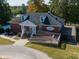 Exterior aerial view of a brick clubhouse with ramps and outdoor decking at 2662 Sledge Rd, Louisburg, NC 27549