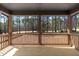 Wooden deck with railings offering beautiful views of the trees and grass at 2662 Sledge Rd, Louisburg, NC 27549