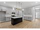 Kitchen with gray cabinets, stainless steel appliances, and a black island at 2662 Sledge Rd, Louisburg, NC 27549