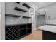Spacious kitchen features gray cabinets, quartz countertops, custom shelving and dining area at 2662 Sledge Rd, Louisburg, NC 27549