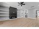 Bright living room with modern fireplace and custom shelving, creating a cozy, inviting space at 2662 Sledge Rd, Louisburg, NC 27549