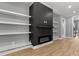 Bright living room with fireplace and custom shelving perfect for entertaining or relaxing at home at 2662 Sledge Rd, Louisburg, NC 27549