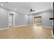 Bright living room with wood floors, a ceiling fan, and access to a screened porch at 2662 Sledge Rd, Louisburg, NC 27549