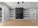 Bright living room with fireplace and custom shelving perfect for entertaining or relaxing at home at 2662 Sledge Rd, Louisburg, NC 27549