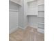 Walk-in closet with shelving and rods for efficient clothing storage at 2662 Sledge Rd, Louisburg, NC 27549