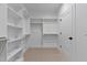 Bright walk-in closet with modern lighting and convenient door access at 2662 Sledge Rd, Louisburg, NC 27549