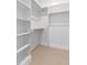 Large walk-in closet with built-in shelves and multiple hanging rods at 2662 Sledge Rd, Louisburg, NC 27549