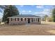 Brick ranch home with a spacious lawn and mature trees at 302 Ellen Dr, Knightdale, NC 27545