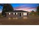 Brick ranch house with a landscaped yard, showcasing a charming curb appeal at 302 Ellen Dr, Knightdale, NC 27545