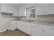 Newly remodeled kitchen with white cabinets and updated countertops at 302 Ellen Dr, Knightdale, NC 27545