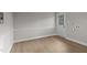Laundry area with vinyl flooring, a door, and space for washer and dryer at 302 Ellen Dr, Knightdale, NC 27545
