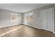 Spacious living area featuring hardwood floors and large windows at 302 Ellen Dr, Knightdale, NC 27545