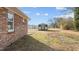 Side yard with shed and brick wall at 302 Ellen Dr, Knightdale, NC 27545