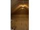Unfinished attic space with exposed beams, offering potential for customization and additional storage at 318 Hinton St, Apex, NC 27502
