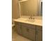 Bathroom featuring a white countertop, grey vanity, and neutral paint at 318 Hinton St, Apex, NC 27502