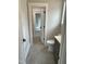 Bathroom featuring grey tile, and modern toilet at 318 Hinton St, Apex, NC 27502