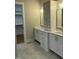 Elegant bathroom featuring dual vanities, plentiful storage, and modern fixtures for a spa-like experience at 318 Hinton St, Apex, NC 27502