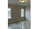 Bedroom featuring two windows with white trim at 318 Hinton St, Apex, NC 27502