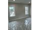 Bedroom featuring two windows with white trim at 318 Hinton St, Apex, NC 27502