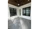 Bright sunroom with tile floor, modern windows, and a stylish ceiling fan, perfect for relaxation at 318 Hinton St, Apex, NC 27502