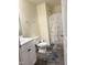 Bright bathroom with a white vanity, daisy-themed shower curtain, and dark wood-look flooring at 3928 Mike Levi Ct, Raleigh, NC 27610