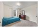 Bedroom with carpeted floors, and a dresser with mirror at 3928 Mike Levi Ct, Raleigh, NC 27610