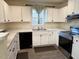Bright kitchen featuring white cabinets, stainless steel appliances, and modern countertops at 3928 Mike Levi Ct, Raleigh, NC 27610