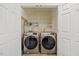 Laundry room with washer and dryer, and overhead shelving at 3928 Mike Levi Ct, Raleigh, NC 27610
