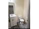 Cozy powder room with white vanity and modern fixtures at 3928 Mike Levi Ct, Raleigh, NC 27610