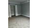 Spacious bedroom with carpet and large closet at 4519 Edwards Mill Rd # J, Raleigh, NC 27612