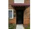 Condo front door with brick facade at 4519 Edwards Mill Rd # J, Raleigh, NC 27612