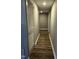 Hallway with wood-look flooring at 4519 Edwards Mill Rd # J, Raleigh, NC 27612