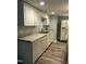 Kitchen with white cabinets and granite countertops at 4519 Edwards Mill Rd # J, Raleigh, NC 27612