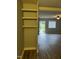 Living room with built-in shelving and hardwood floors at 4519 Edwards Mill Rd # J, Raleigh, NC 27612