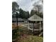 Community pool with gazebo and surrounding fence at 4519 Edwards Mill Rd # J, Raleigh, NC 27612