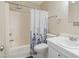 Clean bathroom with a shower/tub combo, white vanity, and updated fixtures at 5112 Flint Ridge Pl, Raleigh, NC 27609
