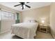 Cozy bedroom with carpeted floor, a queen-size bed, and a ceiling fan at 5112 Flint Ridge Pl, Raleigh, NC 27609