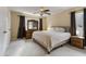 Spacious bedroom with carpeted floors, a king-size bed, and ample closet space at 5112 Flint Ridge Pl, Raleigh, NC 27609