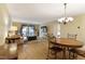 Bright dining area with hardwood floors and a round wooden table at 5112 Flint Ridge Pl, Raleigh, NC 27609