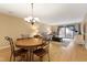 Dining area with hardwood floors and view to living room at 5112 Flint Ridge Pl, Raleigh, NC 27609