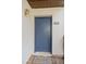 Inviting condo entryway with a blue door and welcome mat at 5112 Flint Ridge Pl, Raleigh, NC 27609