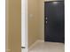 Interior hallway with a dark door and light walls at 5112 Flint Ridge Pl, Raleigh, NC 27609