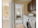 Convenient laundry room with washer, dryer, and access to bedroom at 5112 Flint Ridge Pl, Raleigh, NC 27609
