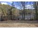 Serene view of a pond and lush green landscape at 5112 Flint Ridge Pl, Raleigh, NC 27609