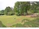 Spacious backyard surrounded by trees and a fence at 5617 Laurel Crest Dr, Durham, NC 27712