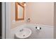 Small half bathroom with pedestal sink at 5617 Laurel Crest Dr, Durham, NC 27712