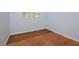 Bright bedroom with hardwood floors and a large window at 5617 Laurel Crest Dr, Durham, NC 27712