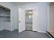 Spacious closet with built-in shelving and adjacent laundry area at 5617 Laurel Crest Dr, Durham, NC 27712