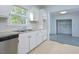 View of kitchen with stainless steel dishwasher and French doors at 5617 Laurel Crest Dr, Durham, NC 27712